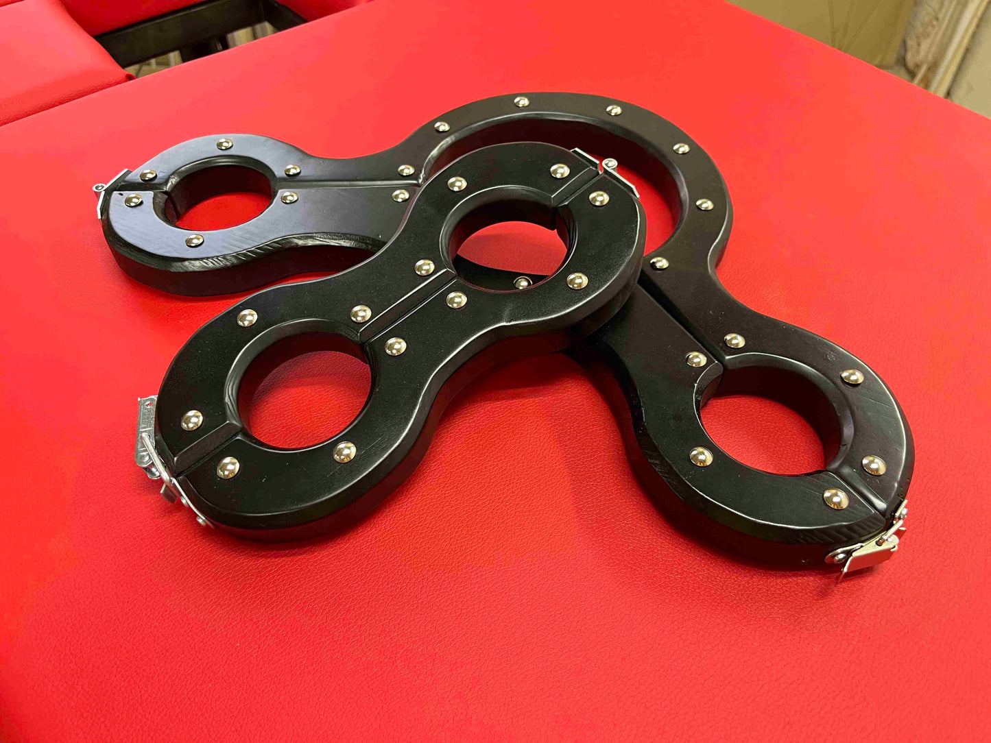 New BDSM shackles made of natural wood. Hand to ankle bondage for spanking.